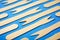 Disposable wooden forks on a blue table