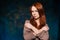 Dissatisfaction red-haired woman posing