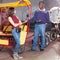 Dissatisfied African-American man driver of rickshaw talking to young female