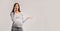 Dissatisfied Pregnant Woman Talking On Cellphone Standing, Gray Background, Panorama