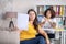 Dissatisfied woman sitting at the reception of a nutritionist.