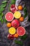 Dissected fresh fruits. Pomegranate, orange, grapefruit and tang