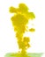 Dissolving clouds of yellow ink in water on a white background
