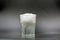 Dissolving instant effervescent tablets in a glass of water closeup