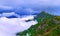 Dissolving texture of aerial landscape view of Caucasian mountains with stormy clouds