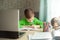 Distance learning Child writting homework with digital tablet. Concept online education
