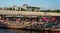 In the distance the Reichstag housing the Bundestag, Berlin Germany. People sitting by the River Spree in 2019 heatwave