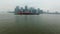 Distant aerial view of Manhattan island and lonely boat