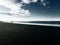 Distant Beach Surfer Walking Towards Water