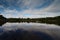 Distant kayaker in Coot Bay Pond, Everglades National Park Florida.