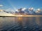 Distant kayakers on Coot Bay in Everglades National Park at sunset.