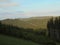 Distant landscape covered in evening sunlight. Panoramic Beskydy image. Mountain forests under blue sky