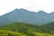 Distant mountains with landslides during rains