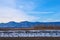 Distant Mountains, Snowbank and Trees