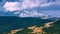 Distant rocky mountains covered with clouds