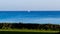 Distant sailboat over the water of the Atlantic Ocean