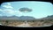 Distant shot of spaceship seen on car on dirt road, UFO design. Generative ai