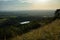Distant shot of Sutton Bank and Lake Gormire under the clouds and sky, England