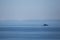 Distant silhouette of submarine ship and the crew