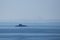 Distant silhouette of submarine ship and the crew