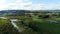 Distant tower against river flowing among green plants