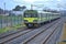 Distant view of entire DART train in action at Blackrock train station