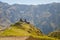 Distant view of Holy Trinity Church in Kazbegi near Stepantsminda view Caucasus mountains in the background