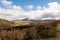 Distant view of Mount Aso volcano releasing steam