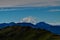 Distant view of Mount Denali - mt Mckinley peak from Mount Healy hike trail with blue sky with white clouds above