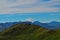 Distant view of Mount Denali mt Mckinley peak from Mount Healy hike trail with blue sky with white clouds above. Denali