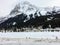 A distant view of the town of Field, in British Columbia Canada, during winter. The landscape is covered in snow