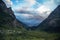 Distant view, valley among high Caucasian mountains, summer evening, dramatic rain clouds. way to Shdugra waterfall, Mazeri,