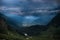 Distant view, valley among high Caucasian mountains, summer evening, dramatic rain clouds. way to Shdugra waterfall, Mazeri,