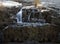 Distant view of water cascading over the Loup Fintry Waterfall