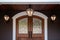 distinct patterned fanlight above a wooden entrance door of a suburban mansion