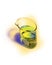 Distorted chemical beaker with bright green solution on yellow halo