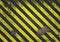A distressed, corroded and rusty black and yellow metal effect hazard warning sign with copy space for design