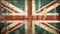 Distressed dark worn background of a vintage Union Jack national flag of the United Kingdom on wooden panel boards