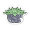 Distressed sticker of a cartoon succulent plant