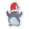 distressed sticker of a happy christmas penguin