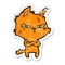 distressed sticker of a tough cartoon cat folding arms