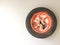 Distressed wheel old tire with red peeled paint spokes round grunge gritty shabby