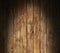 Distressed wooden surface lit dramatically