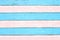 Distressed wooden surface and vintage wood structure conceptual idea faded blue and pink horizontal stripe lines on aged hardwood