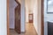 Distributor corridor of a house with light oak flooring and reddish wood