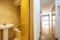 Distributor corridor of a house with an oak wooden corridor, a built-in wardrobe with wooden doors and access to a toilet with a