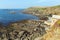 Disused RNLI lifeboat house on The Lizard peninsula Cornwall England UK south of Helston in summer on calm blue sea sky day