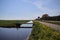 Ditch with water in the Krimpenerwaard area between the meadows along road N210 at krimpen aan den IJssel