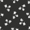 Ditsy monochrome seamless pattern with white flowers on black background