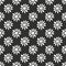 Ditsy monochrome seamless pattern with white flowers on black background